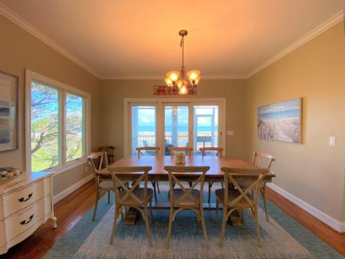 a dining room with a table and chairs at Lookout Point in Edisto Island