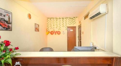 a room with a reception desk in a room at OYO 89703 B Link Hotel in Johor Bahru