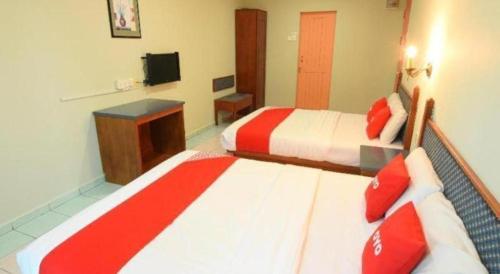 Кровать или кровати в номере OYO 89642 Highway Inn