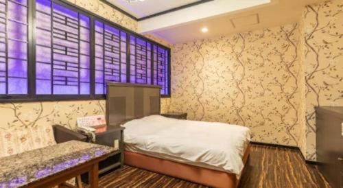 Ένα ή περισσότερα κρεβάτια σε δωμάτιο στο Tabist Hotel Please Kobe