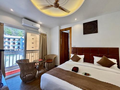 Postel nebo postele na pokoji v ubytování Check Inn Homes, Rishikesh Tapovan