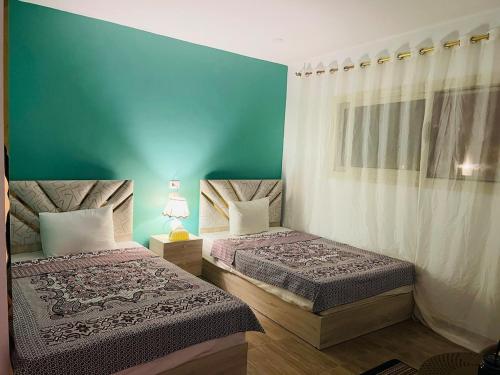 Postel nebo postele na pokoji v ubytování New Farida Pyramids Boutique Hotel