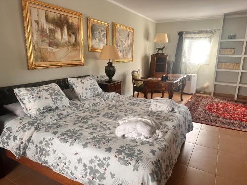 a bedroom with a dog laying on a bed at Villa IRI Habitación N 4 - Suit con balcón in Pineda de Mar