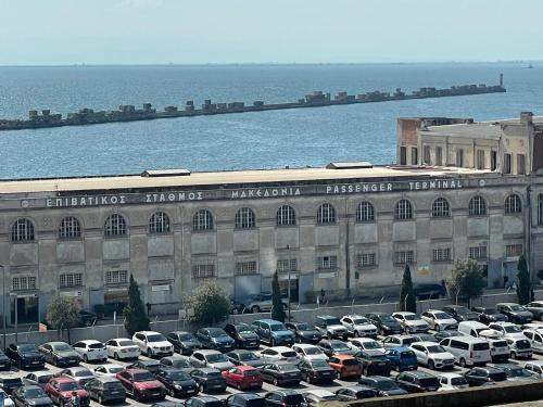 a parking lot full of cars in front of a building at Αnchor Suites in Thessaloniki