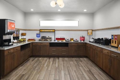a large kitchen with wooden cabinets and a counter top at Hampton Inn St. George in St. George