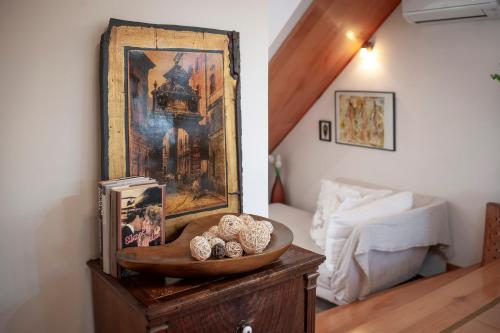 a room with a table with a mirror and a bed at Apartment Studio Lara in Rovinj