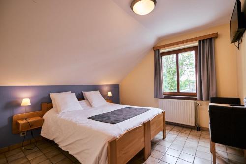Postel nebo postele na pokoji v ubytování Hotel Beau Site