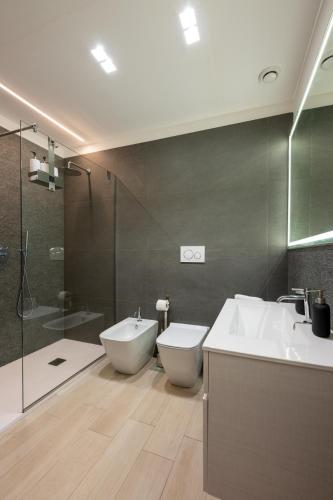 a bathroom with a sink and a toilet and a shower at Principe del Pardo in Catania
