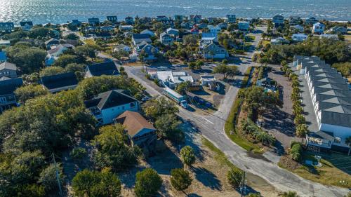 an aerial view of a neighbourhood with houses and the ocean at Serenity Now in Edisto Island