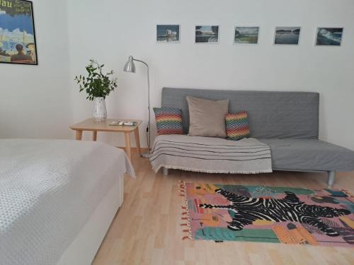a living room with a couch and a rug at Ferienwohnung Seeblick in Lindau