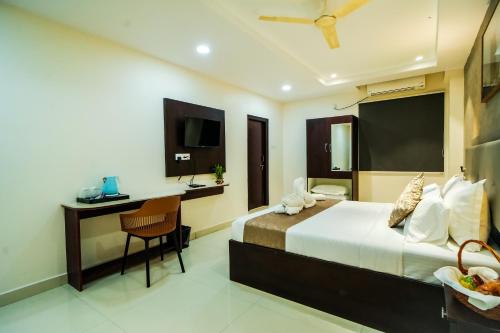 Ένα ή περισσότερα κρεβάτια σε δωμάτιο στο Rhyme Hotel - Hitech City