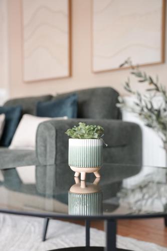 a vase on a table in a living room at Beechgrove House in Livingston