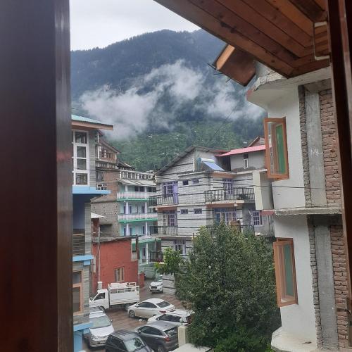 a view from a window of a city at Potala Hotel in Jāmb