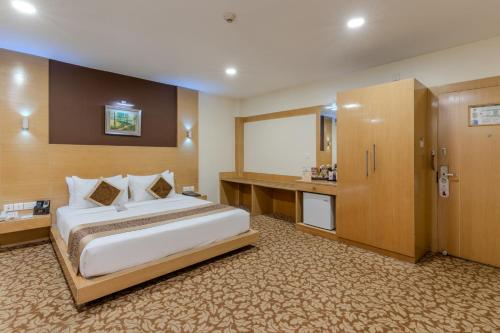 Ένα ή περισσότερα κρεβάτια σε δωμάτιο στο Hotel Patliputra Continental