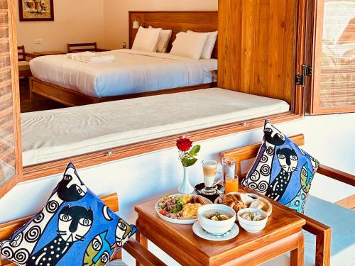 Postel nebo postele na pokoji v ubytování The Jam Boutique Hotel