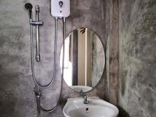 a bathroom with a sink and a mirror at Bhumisiri Hill Khaoyai in Ban Tha Chang