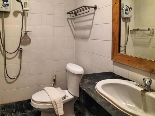 a bathroom with a toilet and a sink and a shower at Bhumisiri Hill Khaoyai in Ban Tha Chang