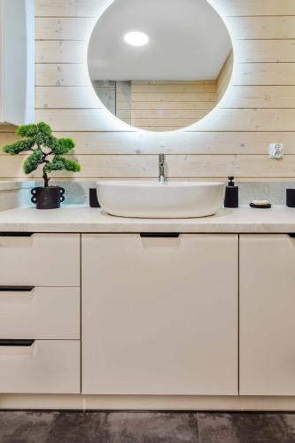 a bathroom with a sink and a mirror at Ostoja Warmia in Stawiguda