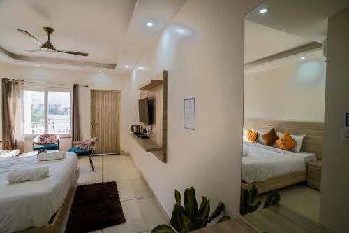 Postel nebo postele na pokoji v ubytování Hide-In Rishikesh