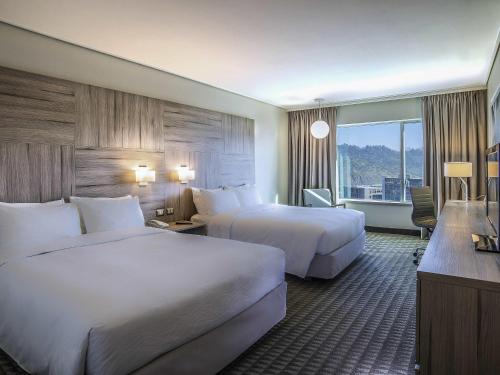 Cama o camas de una habitación en Pullman Santiago Vitacura