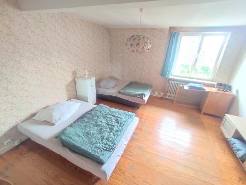 Katil atau katil-katil dalam bilik di Wood Is Good! Kelkheim Central 24 7 Check In