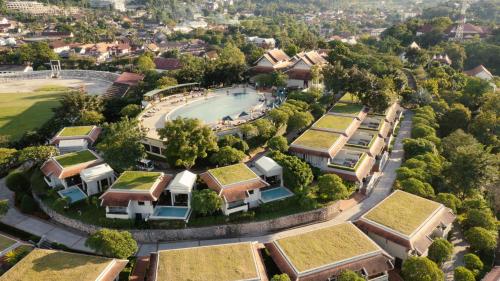 an aerial view of houses with grass roofs at Luang Prabang View Hotel in Luang Prabang
