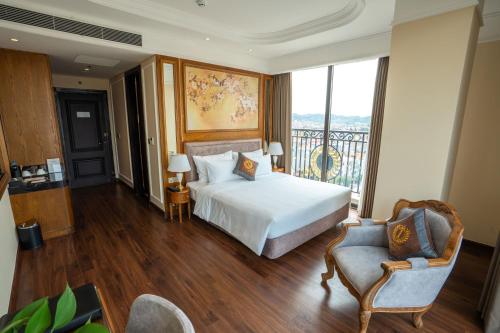 a hotel room with a bed and a balcony at Imperial Hotel Lạng Sơn in Lạng Sơn