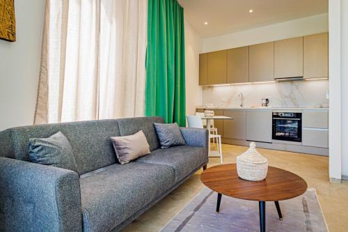 a living room with a couch and a table at The Edge in Bijilo