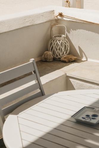 a bed and a chair in a room at Kea Villa Thea by A&D Properties in Otzias