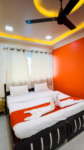 Postel nebo postele na pokoji v ubytování Setrac Orange Hotel