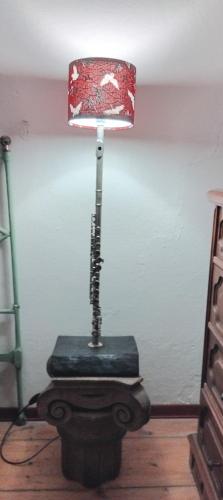 a lamp sitting on a wooden floor in a room at b&b da Gianduia in San Piero in Bagno