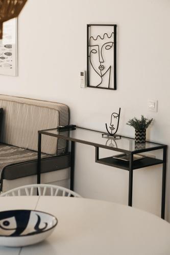a dining room with a table and a shelf at Kea Villa Thea by A&D Properties in Otzias