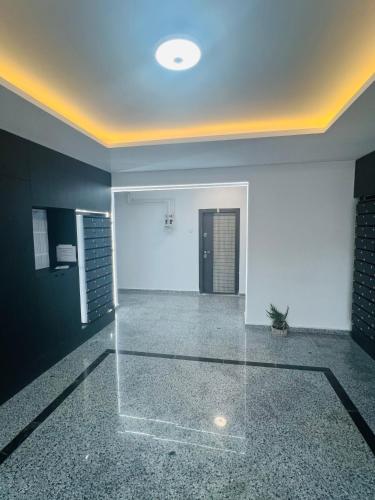 a living room with a glass floor and a ceiling at RxM HOME CITY in Chiajna