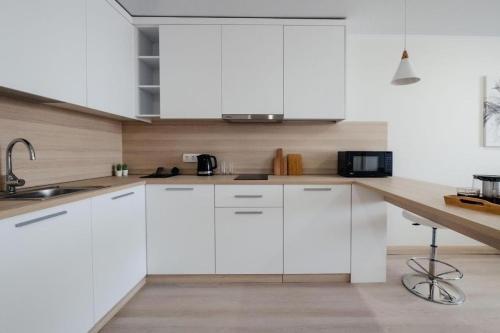 Η κουζίνα ή μικρή κουζίνα στο Torre apart hotel by Windham