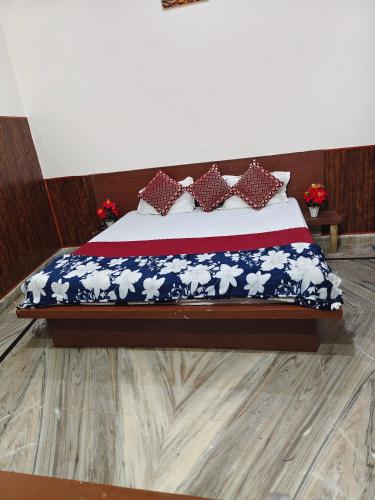 a bed in a room with an american flag bedspread at Hotel Saroj Residency in Jāmb