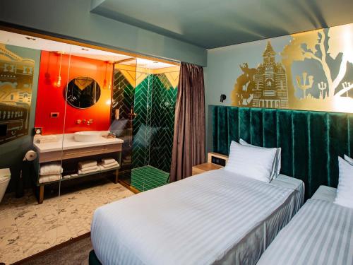 Кровать или кровати в номере Mercure Timisoara