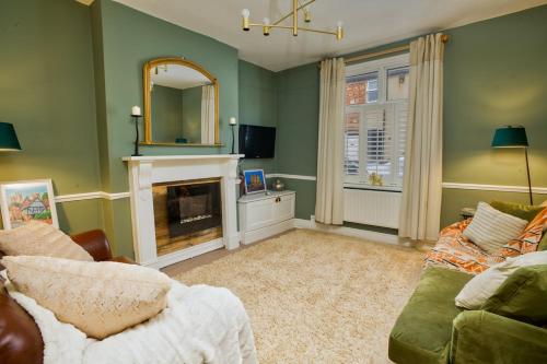 a living room with a couch and a fireplace at Charming 3-Bedroom Home Close to Attractions in Lincoln