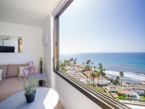 a living room with a view of the ocean at Aguila Beach Ocean View By CanariasGetaway in San Agustin