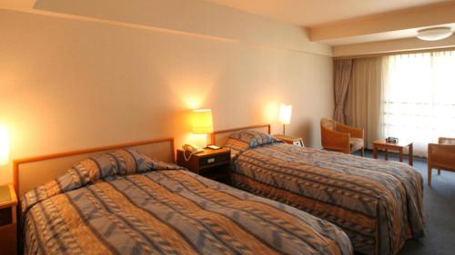 Cama o camas de una habitación en LiVEMAX Resort Echigo Yuzawa