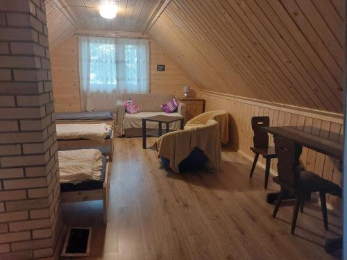 Postel nebo postele na pokoji v ubytování Leśna chatka