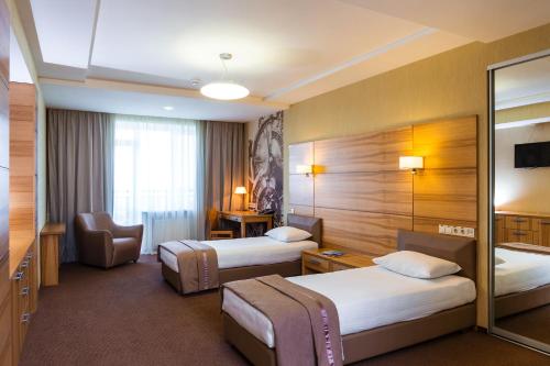 Postel nebo postele na pokoji v ubytování Zagrava Hotel