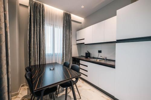 Kuchyň nebo kuchyňský kout v ubytování Day LUX Aparthotel