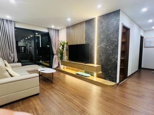 TV a/nebo společenská místnost v ubytování Ha Đo Centrosa Building , Ba Thang Hai street, distrist 10