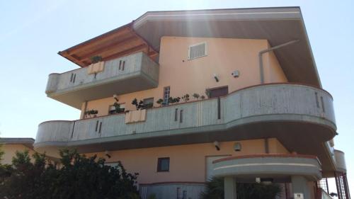 a building with balconies on the side of it at B&B Mirella in Citta' Sant'Angelo