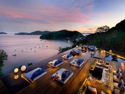 a view of a hotel with a view of the water at V Villas Phuket - MGallery Collection in Panwa Beach