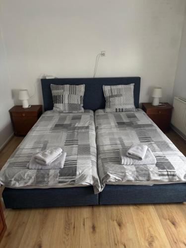 a bedroom with two beds with pillows and blankets at Studio in Maastricht te huur in Maastricht