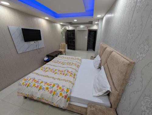 Postel nebo postele na pokoji v ubytování Happy In- Laxmi Nagar