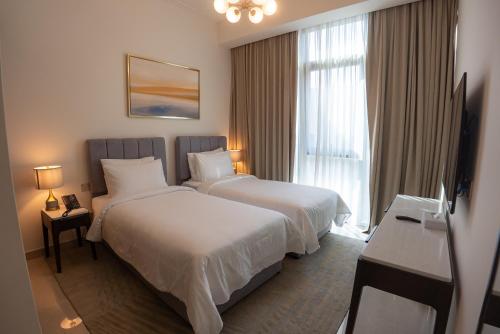 Postel nebo postele na pokoji v ubytování Address Beach Resort Residence Bahrain