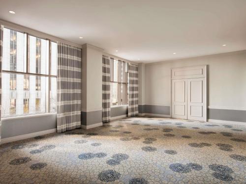 an empty room with a door and windows at Fairmont Chicago Millennium Park in Chicago