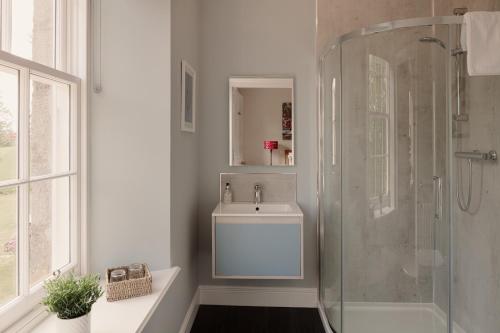 a bathroom with a shower and a sink at Elrick Estate - Little Elrick in Newmachar
